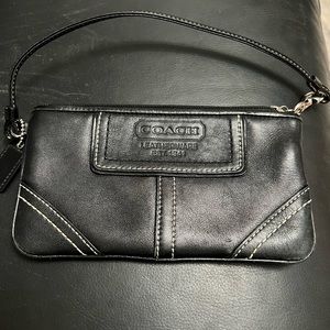 Like new vintage black leather 7x4” coach wristlet with original duster bag